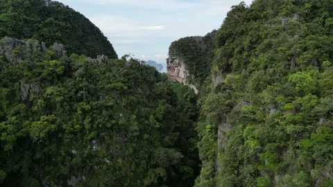 Aerial View Flying Through Limestone Canyon Revealing Koh Poda in Krabi, Ao Stock Footage 334777011