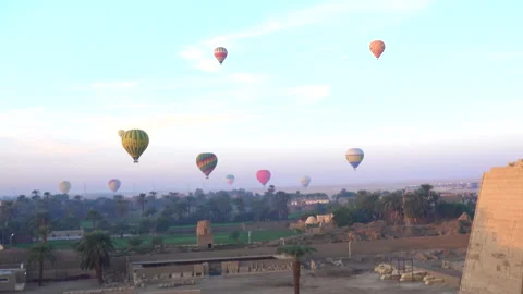 Aerial view flying through Medinet Habu temple from hot air balloon near Vall Stock Footage 144331040