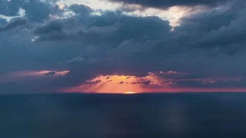 Aerial view flying through thunderclouds at sunset. 4K Stock Footage 225071677