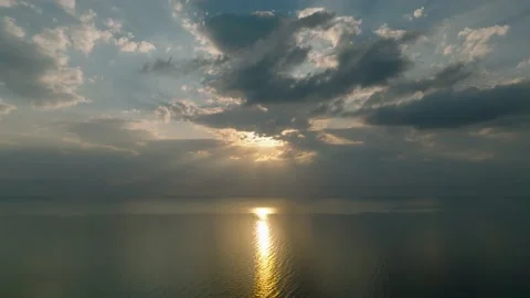 Aerial view flying through thunderclouds at sunset. 4K Stock Footage 225096291