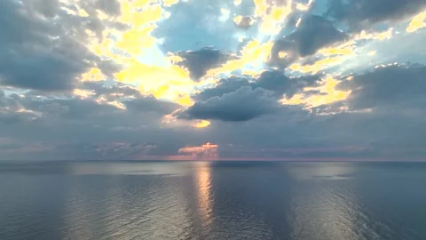 Aerial view flying through thunderclouds at sunset. 4K Stock Footage 225101471