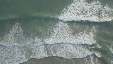 Aerial view of foaming breaking waves in sea, ocean. Water surface seascape 動画素材 141252145