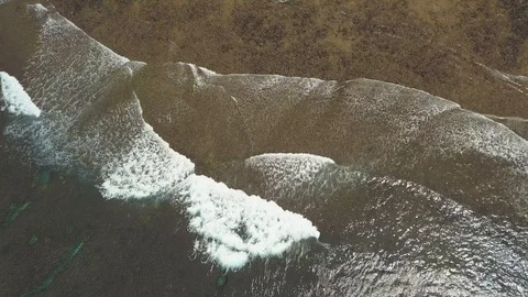 Aerial view-Foamy waves rolling near shore at surfing capital in the Philippines Stock Footage 115958084
