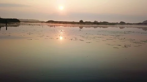 Aerial view of fog over the marsh at dawn Stock-Footage 106674471