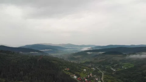 Aerial View Of Foggy Mountains With Clouds, Rain, And A Mystical Scene. Vidéo 299671663