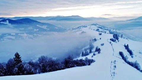 Aerial view in foggy sunset winter mountain Stock Footage