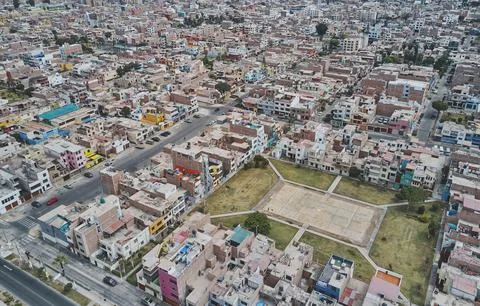 Aerial view of the football field in the middle of a messy neighborhood, Callao Stock Photos