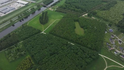 Aerial view of forest, canal, buildings in De Groene Kathedraal, Netherlands. Stock Footage 279727776