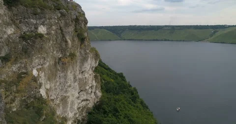 Aerial view of  a forest covered hillside  of the Dniester River. Bakota Ukraine 스톡 동영상 112989955