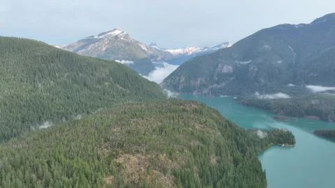 Aerial View of Forest-Covered Mountains and Lake in North Cascades National Park Stock Footage 246974776