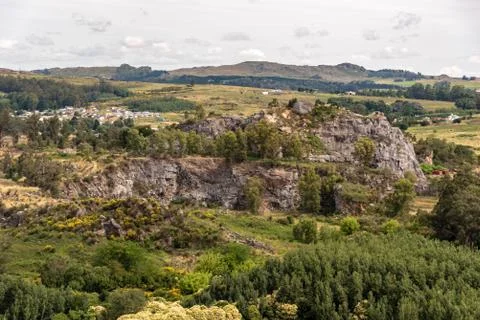 Aerial view of a forest with different types of trees and a quarry of stones Stock Photos