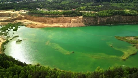 Aerial View of Forest Lake with Shallow Areas and Dolomite Cliff This aerial vie Stock Footage 277357789