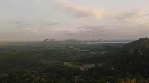 Aerial view of forest mountains during golden sunset Stock Footage 252702897