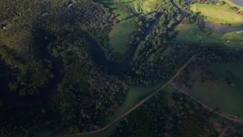 Aerial view of forest river and golf course Stockbeeldmateriaal 334843051