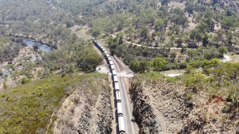Aerial View of a Forest River Train Stock Footage 139552657