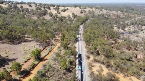 Aerial View of a Forest River Train Stock Footage 139620764