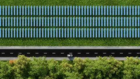 Aerial view of forest road surrounded by trees and solar panels Stock Footage 150523363