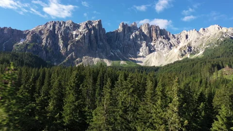 Aerial view forest trees and rugged mountain landscape Dolomites Italy 動画素材 137734191