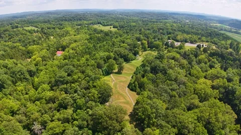 Aerial view of a forested area with serpent mound and effigy from above. Stock Footage 336509005