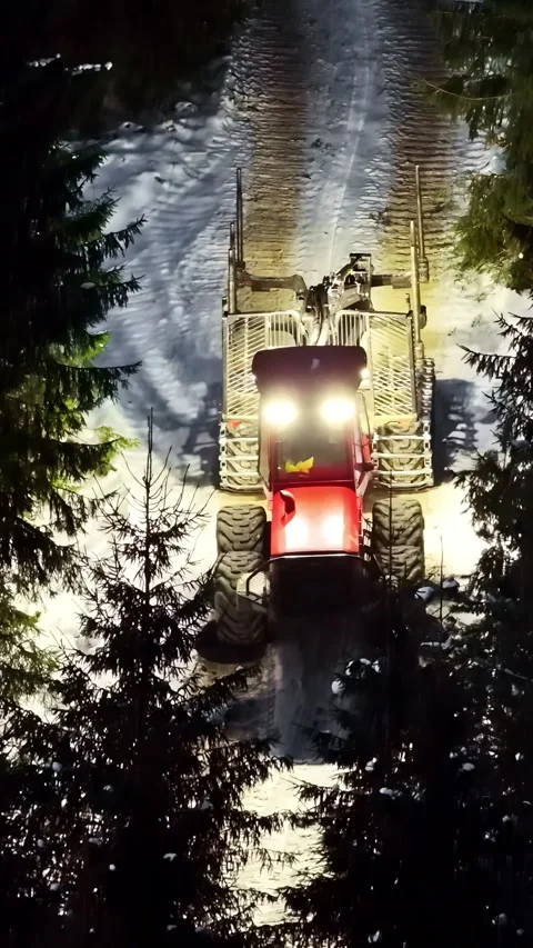 Aerial view of forestry machine in snowy forest, Latvia. Stock Footage 339801922
