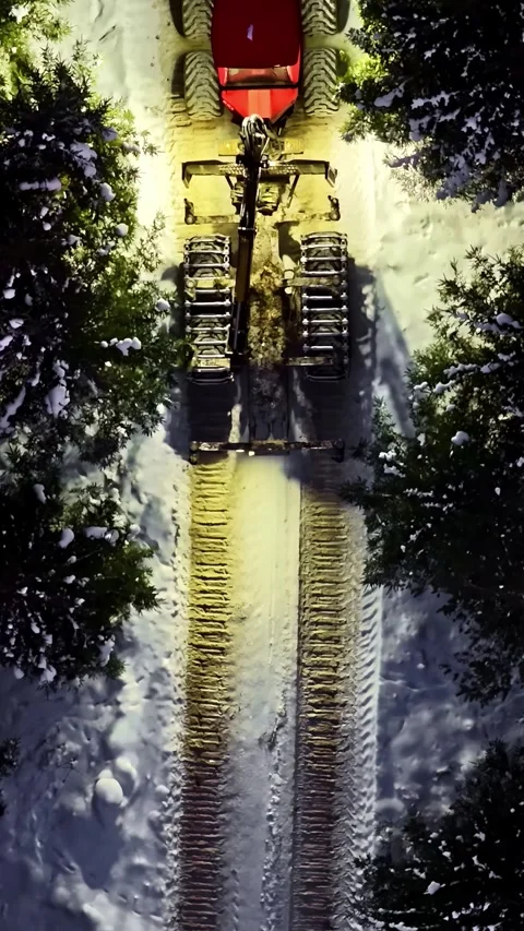 Aerial view of forestry machine in snowy forest, Latvia. Stock Footage 339802783