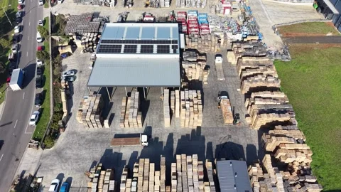 Aerial view of a forklift loading wood pallets onto a truck Video stock 339304394