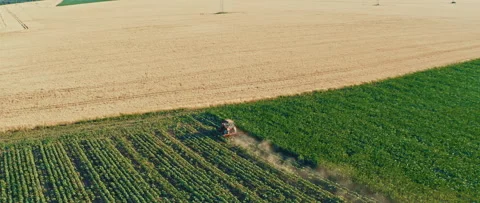 Aerial view form drone tractor plowing field. Anamorphic 1.33 footage Stock Footage 244994057
