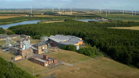 Aerial view of a former coal mine and a modern wind farm Stock Footage 336807839