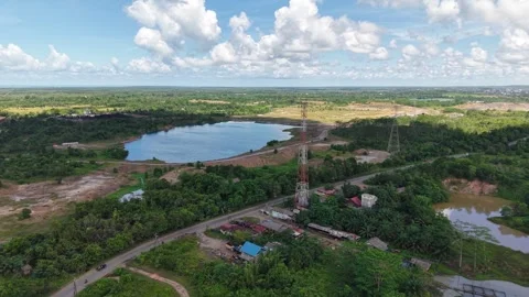 An aerial view of a former coal mine pit filled with blue water, with haul .. Stock Footage 342478881