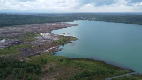 Aerial view of a former coal mining pit that holds water like a blue lake, .. Stock Footage 325640205