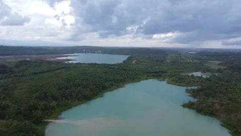 Aerial view of a former coal mining pit that holds water like a blue lake, .. Stock Footage 326194785