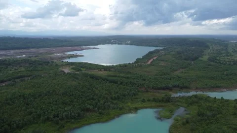 Aerial view of a former coal mining pit that holds water like a blue lake, .. Stock Footage 326194875