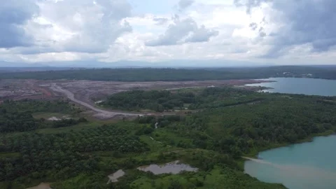 Aerial view of a former coal mining pit that holds water like a blue lake, .. Stock Footage 327048178