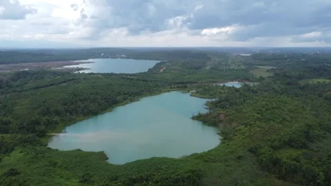 Aerial view of a former coal mining pit that holds water like a blue lake, .. Stock Footage 327048300
