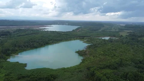 Aerial view of a former coal mining pit that holds water like a blue lake, .. Stock Footage 327048306