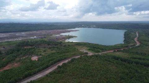 Aerial view of a former coal mining pit that holds water like a blue lake, .. Stock Footage 327048391