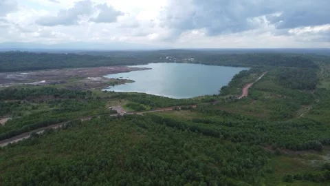 Aerial view of a former coal mining pit that holds water like a blue lake, .. Stock Footage 327048393