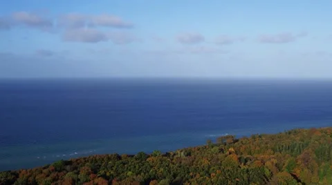Aerial view of an forrest during fall next to the baltic sea Stock Footage 58787382