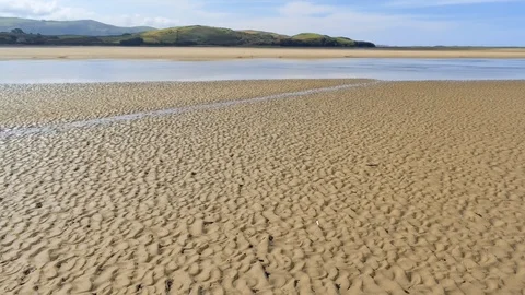 Aerial view, forward move. Drone panorama over low tide sea, mud and sand Video stock 94238158