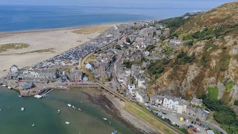 Aerial view, forward move. Drone panorama over sea, harbor, beach and old tow Stock Footage 94254432
