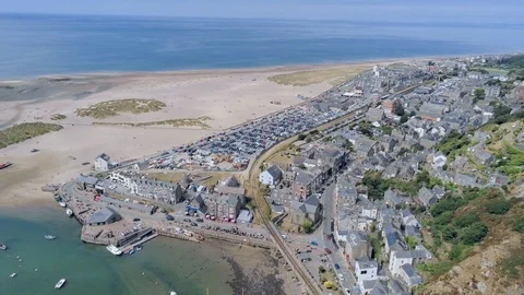 Aerial view, forward move. Drone panorama over sea, harbor, beach and old tow Stock Footage 94255114