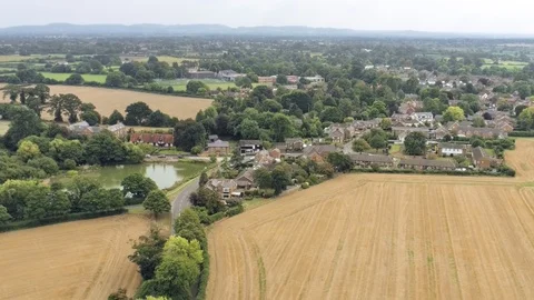 Aerial view, forward sideways move. Christleton village residential area amon Video stock 95567816