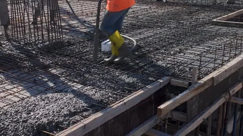 Aerial View: The foundation takes shape as workers and engineers collaborate to Stock Footage 296072654