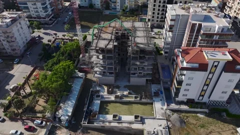 Aerial View: The foundation takes shape as workers and engineers pour concrete Stock Footage 296073382