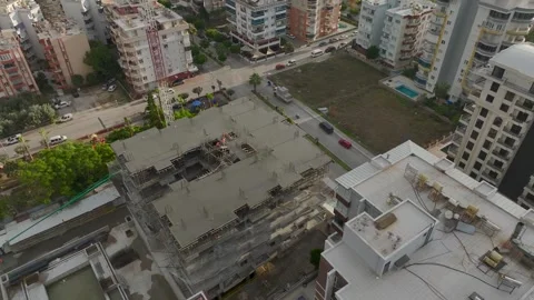 Aerial View: The foundation takes shape as workers and engineers pour concrete Stock Footage 296075072