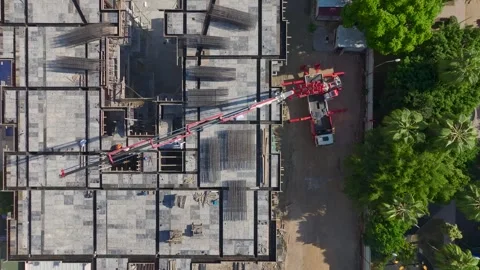 Aerial View: Foundation work in progress with skilled workers pouring concrete Stock Footage 296173667