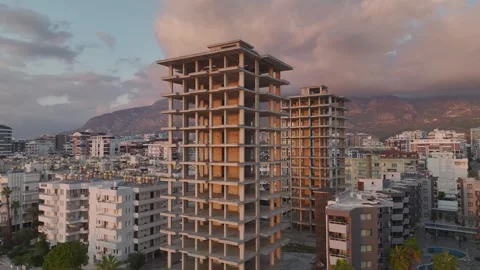 Aerial View: The framework of a high-rise building on the first line of the Stock Footage 296079738