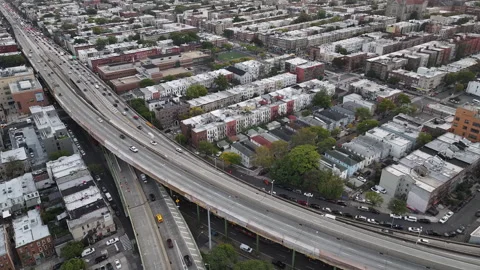 Aerial view of a freeway cutting through Brooklyn Video stock 253981251