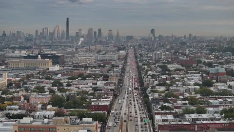 Aerial view of a freeway cutting through Brooklyn Stock Footage 253982801