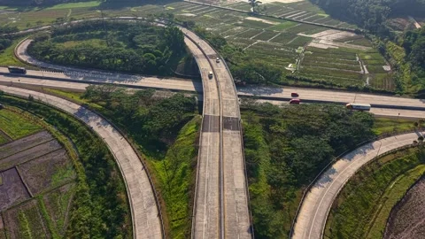 Aerial view of freeway loop interchange with vehicles driving through Stock Footage 341924814